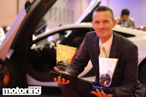 [Mark Harrison of McLaren picks up awards for best supercar and COTY for the MP4-12C]