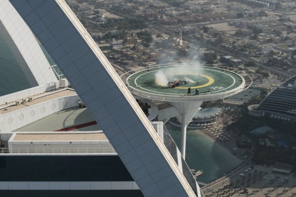 Infiniti Red Bull F1 car doing donuts on Burj Al Arab helipad in Dubai, UAE