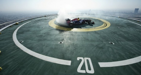 Infiniti Red Bull F1 car doing donuts on Burj Al Arab helipad in Dubai, UAE