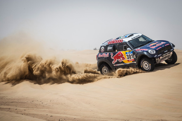 Driving X-Raid Mini All4 Racing rally car in the Dubai desert